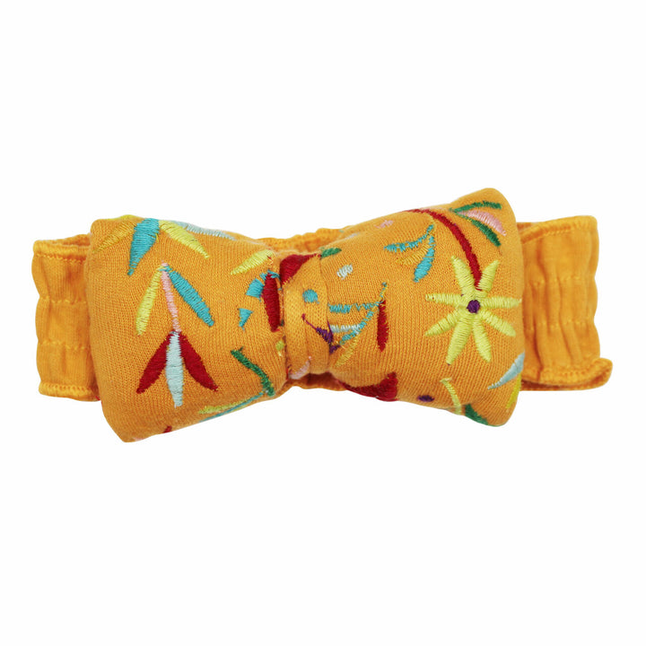 Embroidered Bowtie Headband in Tangerine Floral, an orange base fabric with multi colored embroiderred flowers.
