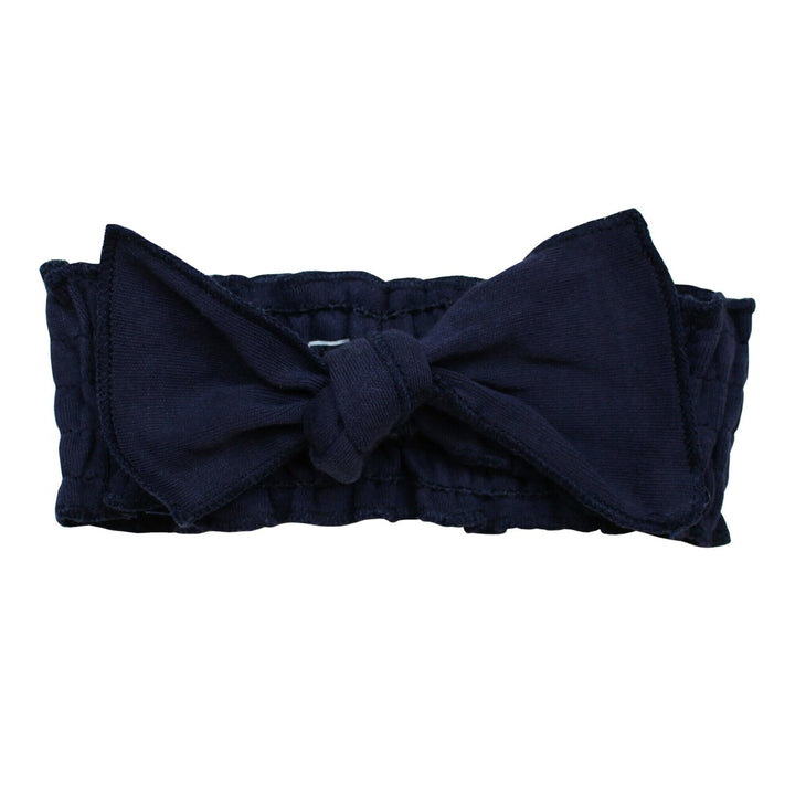 Organic Smocked Tie Headband in Navy, a dark blue color.