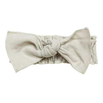 Organic Smocked Tie Headband in Stone, an off white color.