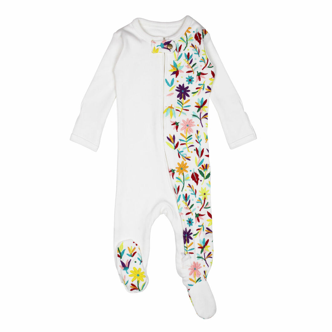 Embroidered Zipper Footie in White Floral, a white base fabric with multi colored embroiderred flowers.