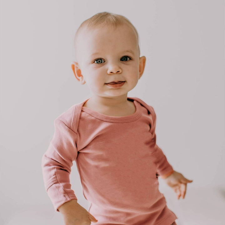 Child wearing Organic L/Sleeve Shirt in Mauve.