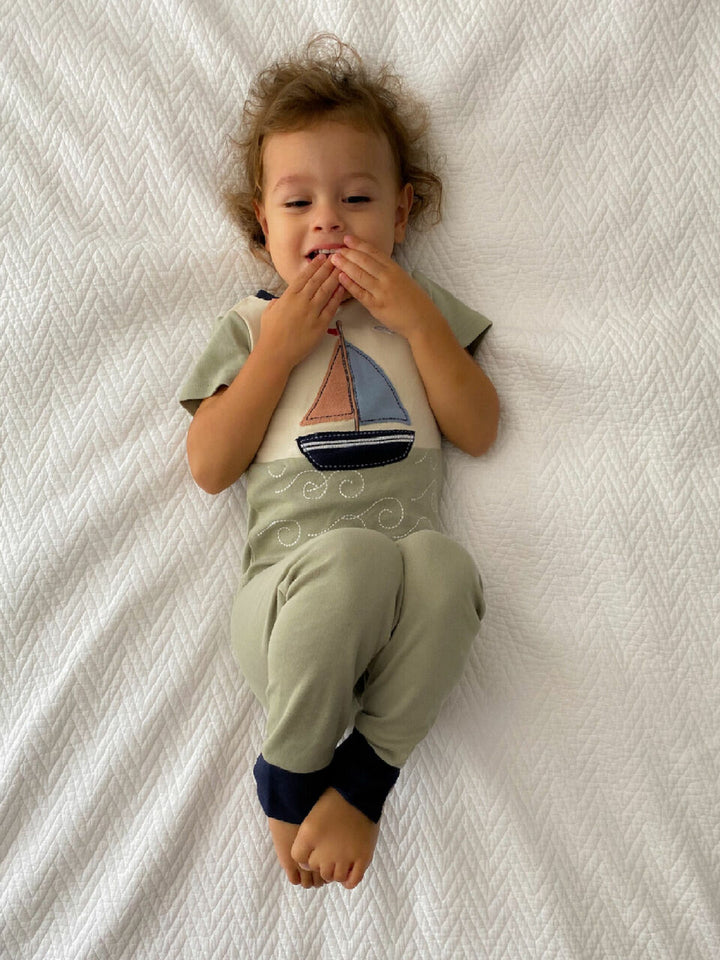 Child wearing Kids' AppliquÃ© Short Sleeve PJ Set in Sailboat.