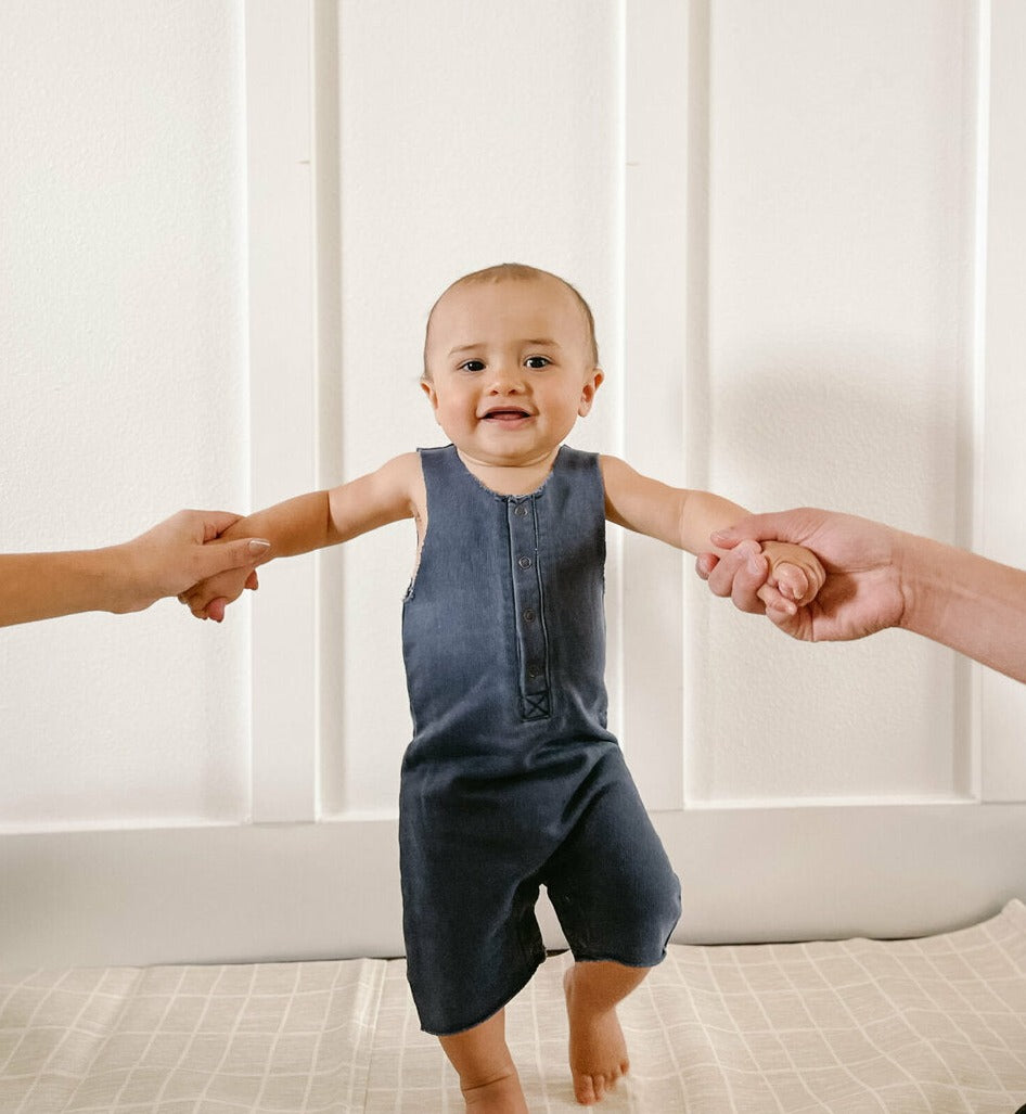 Child wearing French Terry 2-Sided Romper in Indigo.