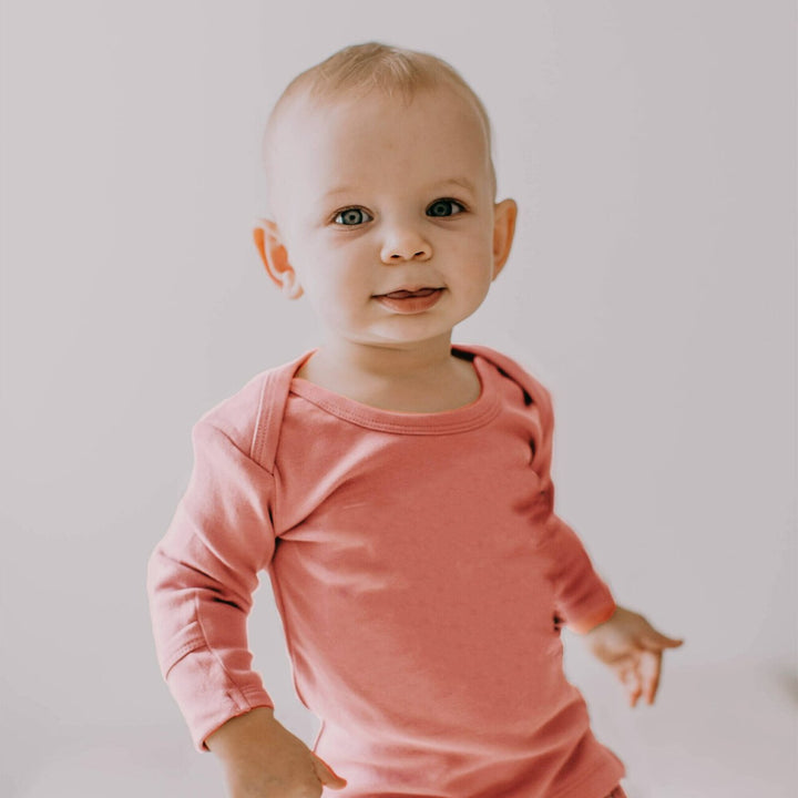 Child wearing Organic L/Sleeve Shirt in Coral.