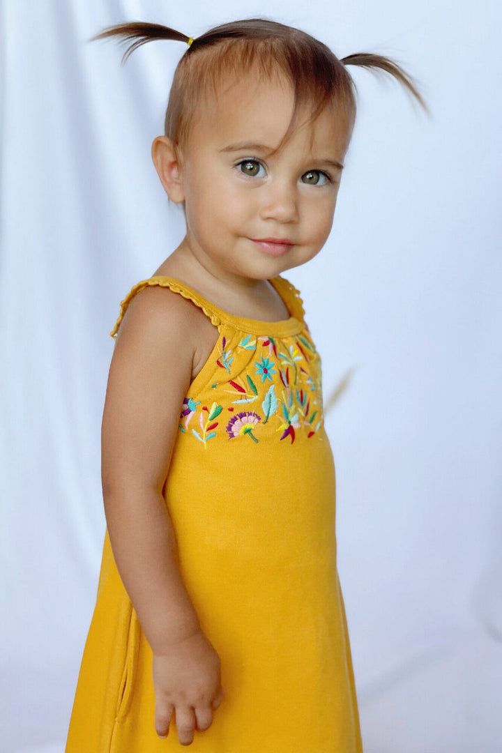Child wearing Embroidered Twirl Dress w/Pockets in Tangerine Floral.