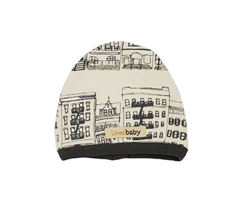 Organic Cute Cap in Beige City Block, a cream colored fabric with brownstone print.