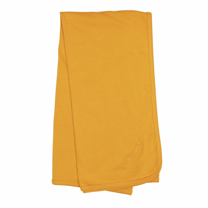 Organic Swaddling Blanket in Tangerine, a bright orange color.