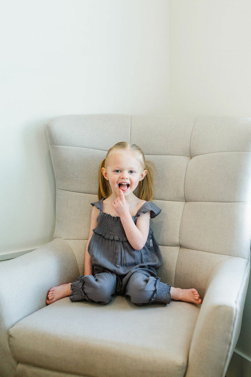 Child wearing Organic Kids' Muslin Sleeveless Romper in Moonstone.