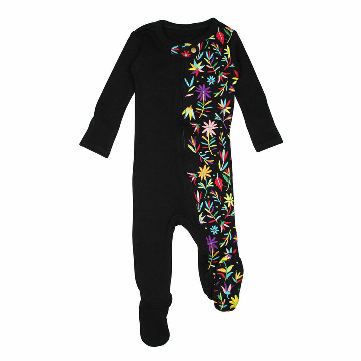 Embroidered Zipper Footie in Black Floral, a black base fabric with multi colored embroiderred flowers.
