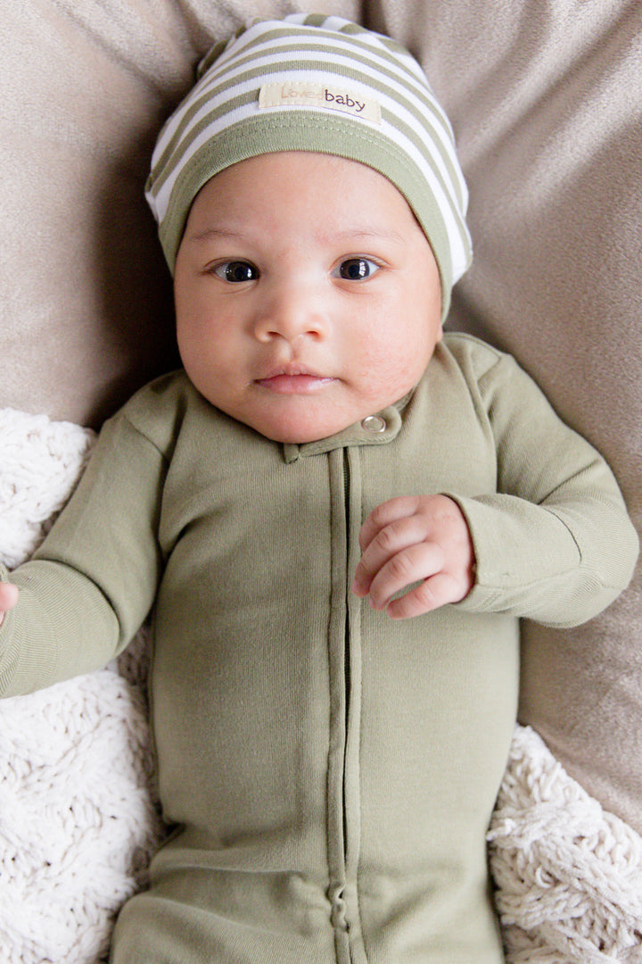 Child wearing Organic Cute Cap in Sage/White. Credit: erin.ntiaddae
