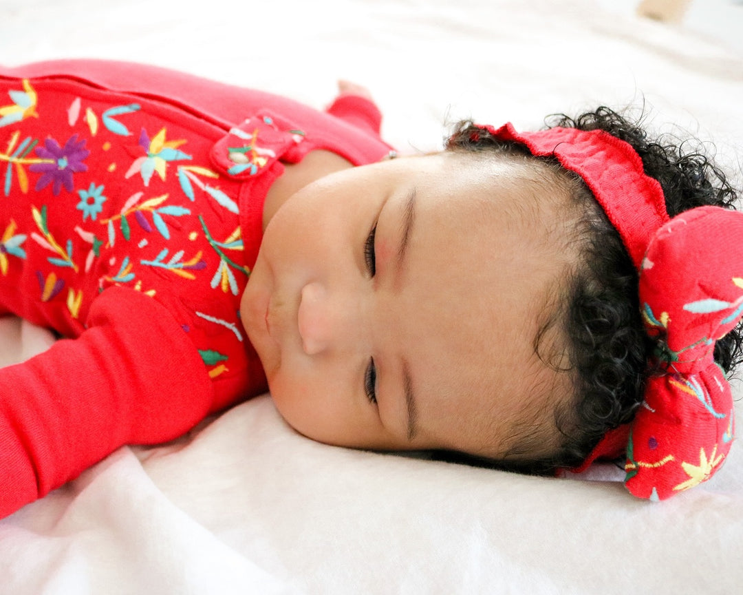 Child wearing Embroidered Bowtie Headband in Chili Pepper Floral.