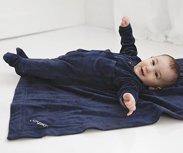 Child wearing Organic Velour Footed Overall in Navy