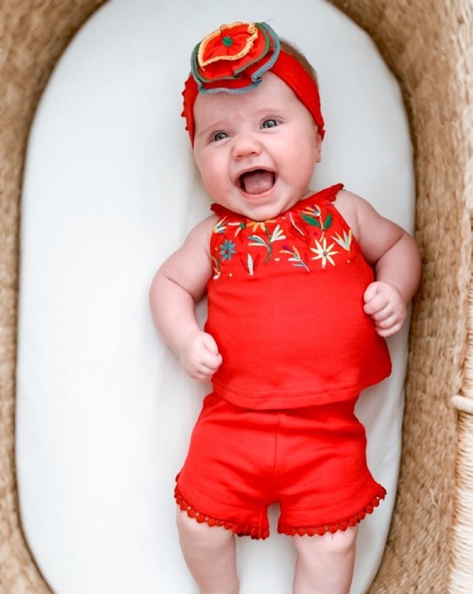 Child wearing Embroidered Flower Headband in Chili Pepper.