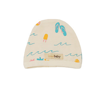 Organic Cute Cap in Beige Surf, a cream colored fabric with surfing prints.