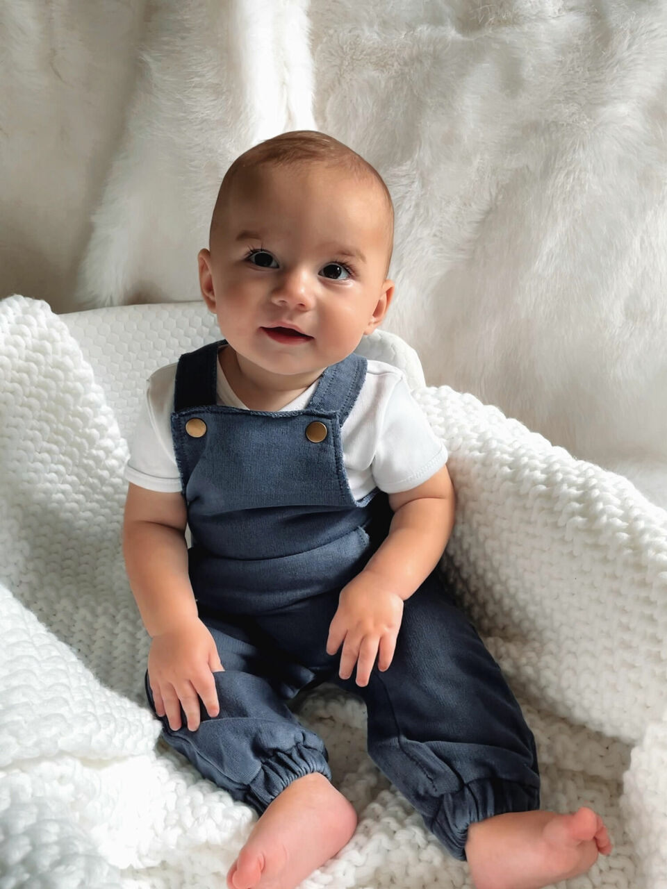 Child wearing French Terry Overall Romper in Indigo.