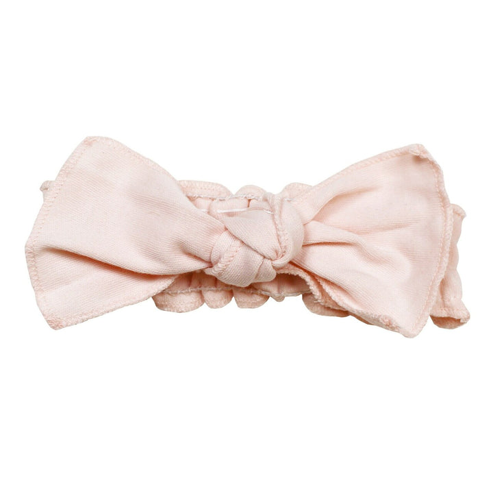 Organic Smocked Tie Headband in Blush, a pale pink color.
