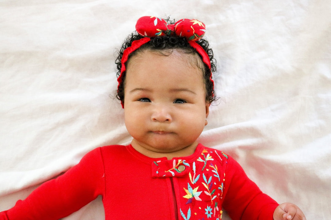 Child wearing Embroidered Bowtie Headband in Chili Pepper Floral.
