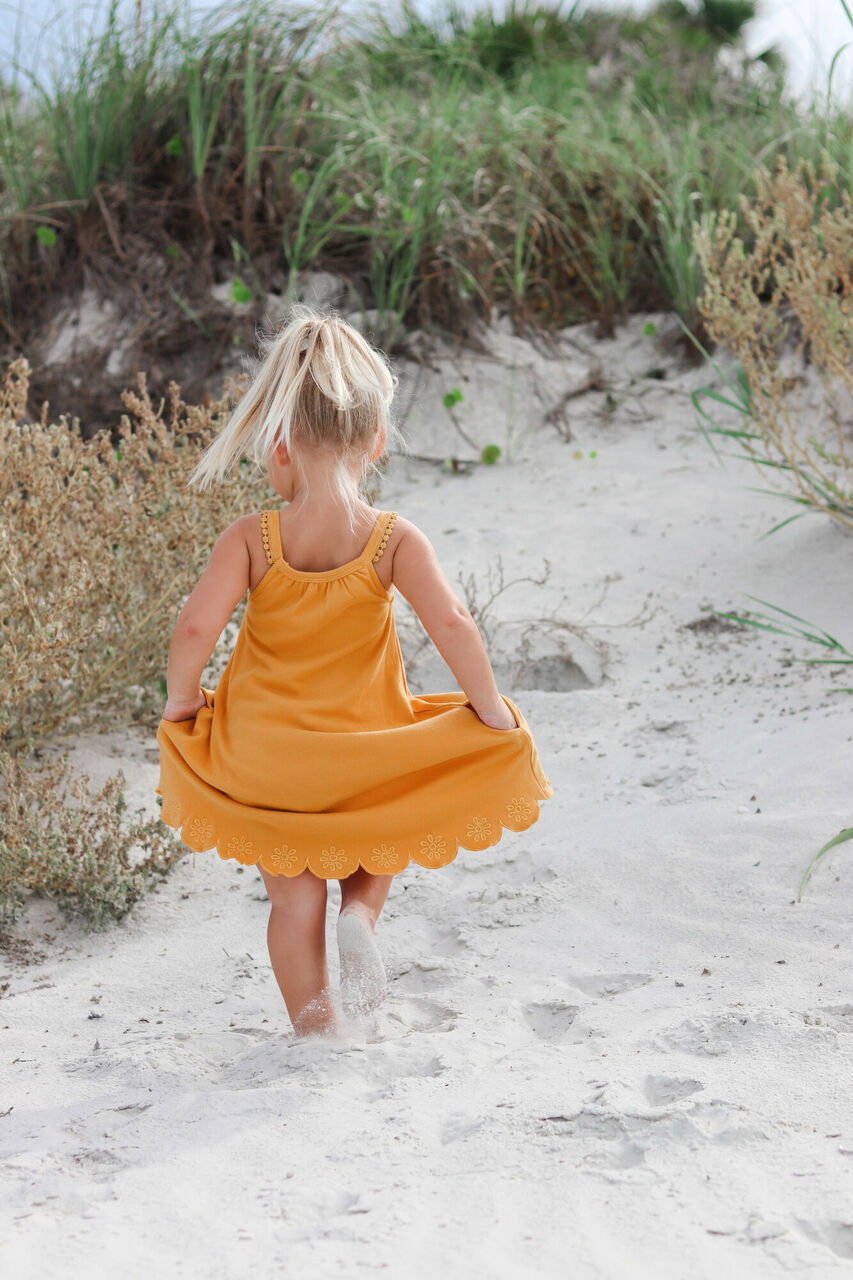 Child wearing Kids' Embroidered Twirl Dress w/Pockets in Tangerine Floral.