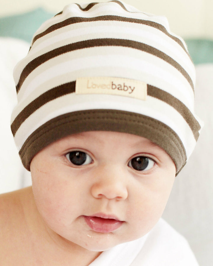 Child wearing Organic Cute Cap in Bark Stripe.