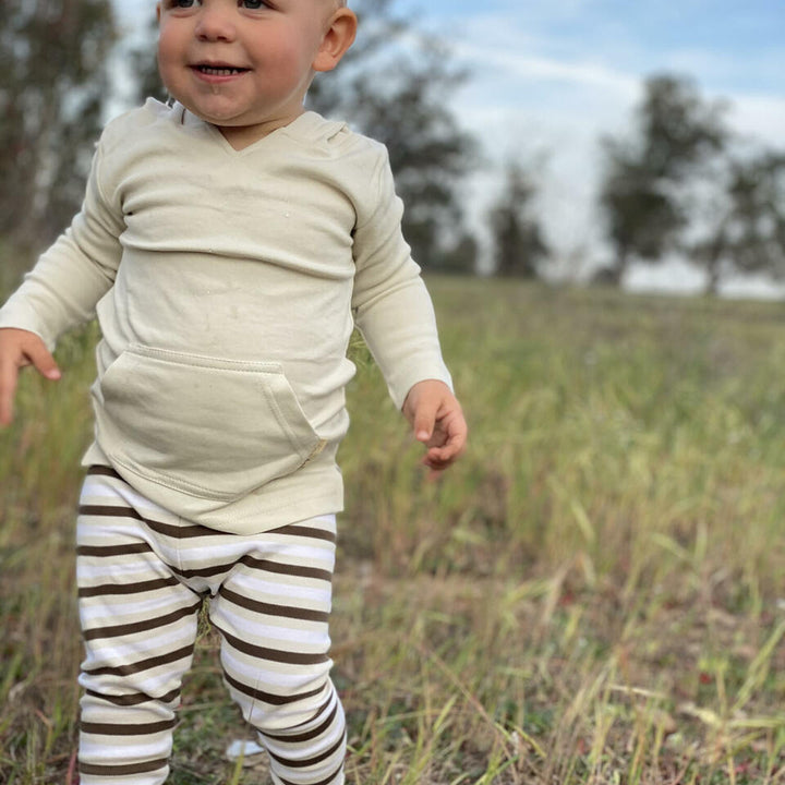 Child wearing Organic Leggings in Bark Stripe. Credit: Michellle_johnson