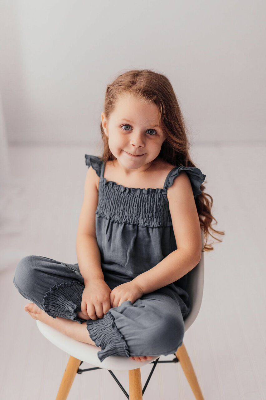 Child wearing Organic Kids' Muslin Sleeveless Romper in Moonstone.