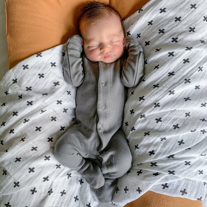 Child wearing Organic Snap Footie in Gray. Credit: @heather_gentry3