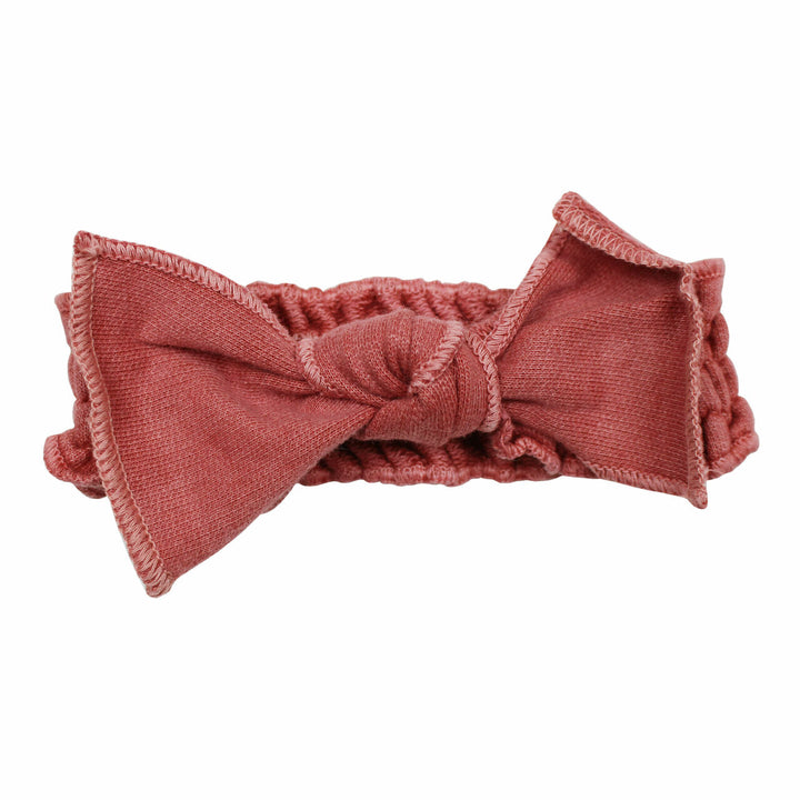 French Terry Smocked Headband in Sienna, a dark pink color.