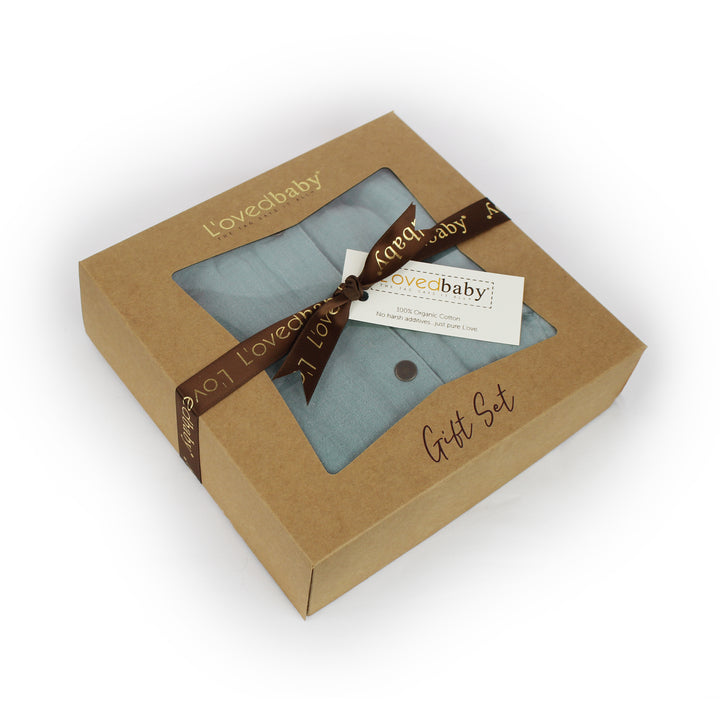 Image of cardboard box (recycled Kraft paper stock) with L'ovedbaby logo and words "gift set" printed on top side, and tied with L'ovedbaby logo ribbon. 