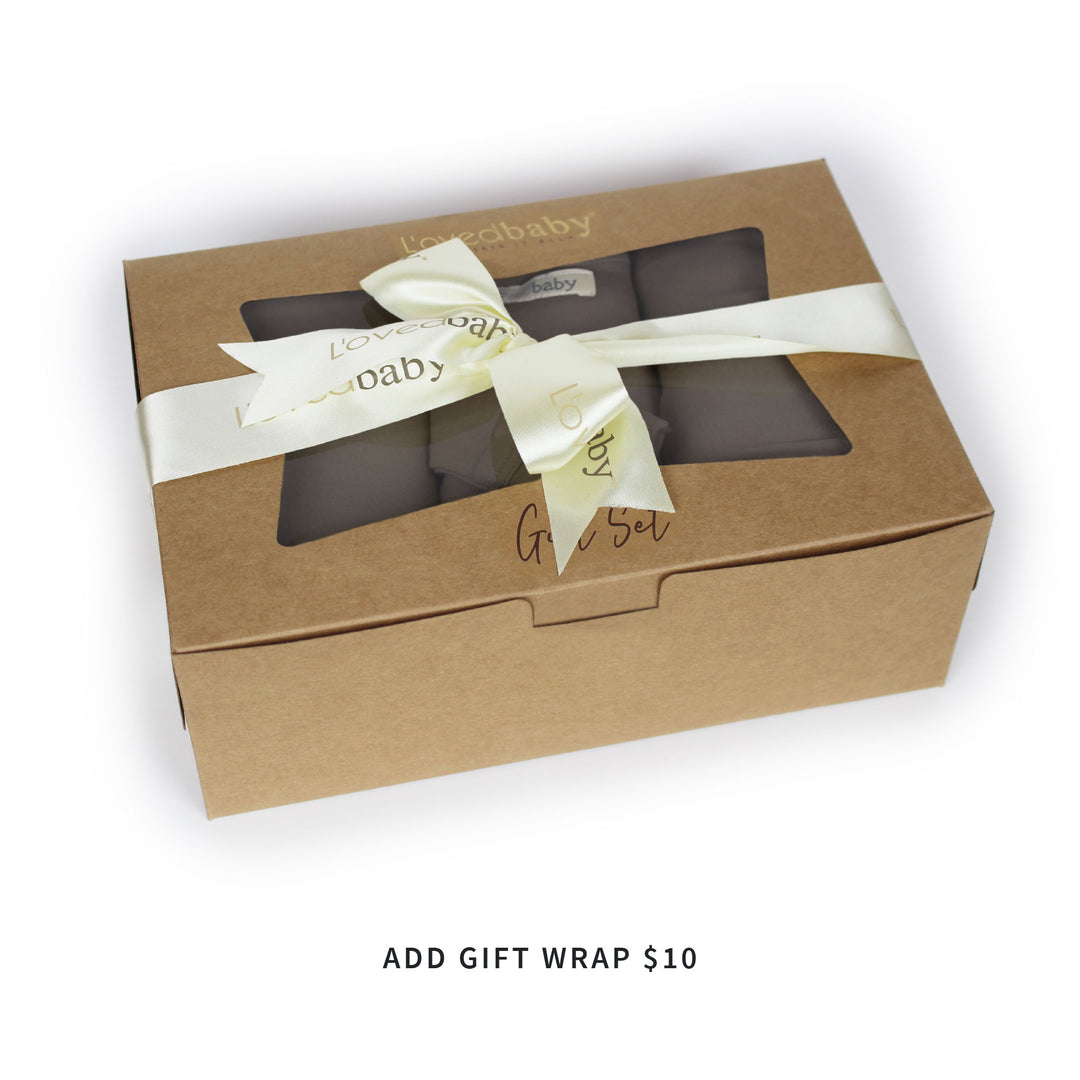 Image of cardboard box (recycled Kraft paper stock) housing mommy and me gift set, and tied with L'ovedbaby logo ribbon. Text just below box says "ADD GIFT WRAP $10".